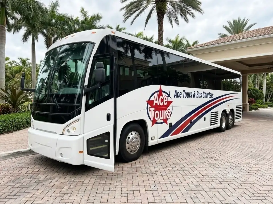 Illustration of an Ace Tours motorcoach waiting in a Fort Lauderdale hotel's long driveway, front passenger door open