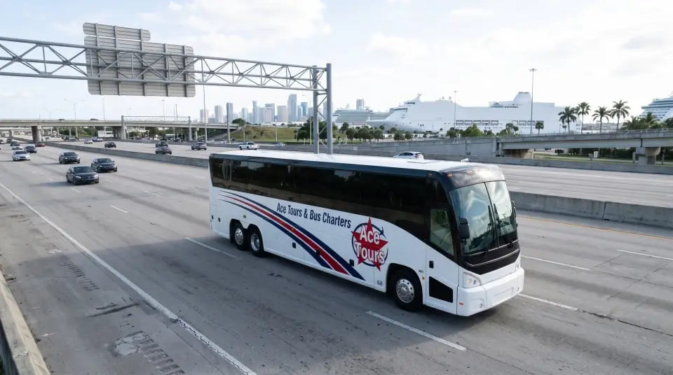 Illustration of a white Ace Tours & Bus Charters motorcoach on I-95 seen from a low drone angle, with the Miami skyline and plain white cruise ships far ahead