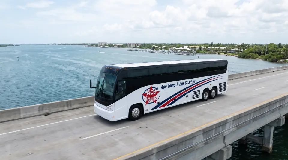 Illustration of a white Ace Tours & Bus Charters motorcoach crossing the Roosevelt Bridge in Stuart over the wide St. Lucie River