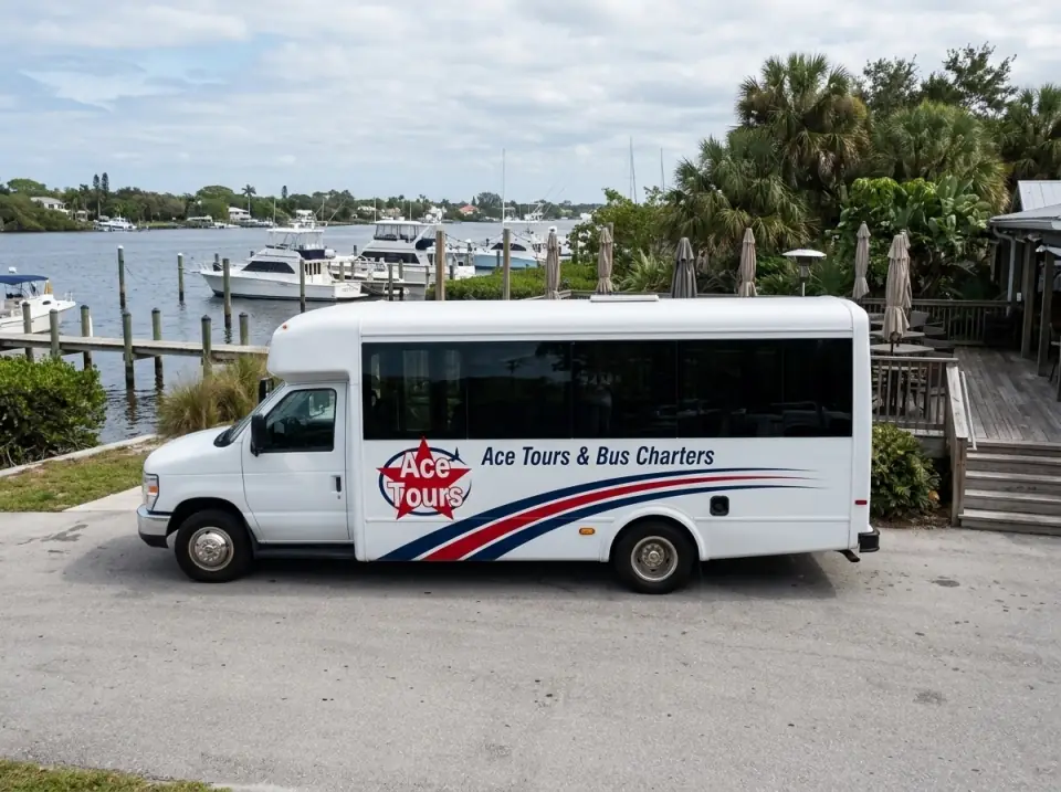 Illustration of a white Ace Tours & Bus Charters minibus parked at a riverfront restaurant in Stuart with a wooden dock and boats