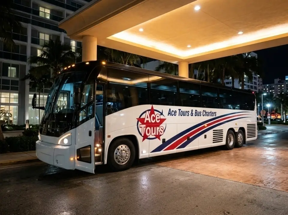Illustration of a white Ace Tours & Bus Charters motorcoach waiting at a Miami Beach hotel driveway at night with its door open and warm lights under the canopy