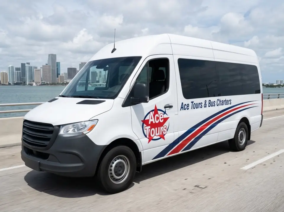 Illustration of a white Ace Tours & Bus Charters Sprinter-style van driving across a bridge over Biscayne Bay with the Miami skyline behind
