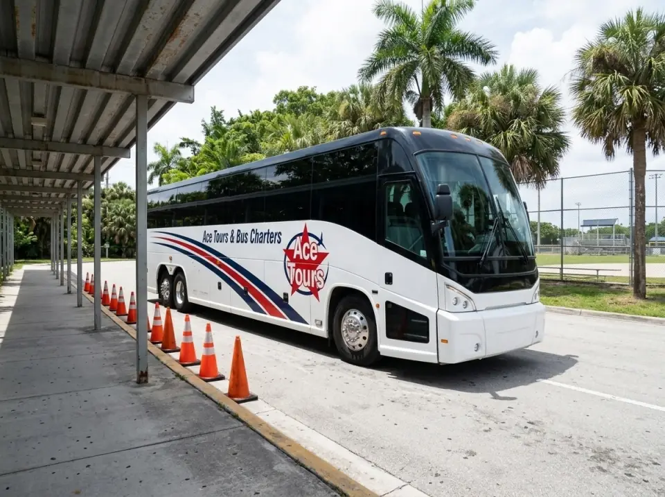 Illustration of a white Ace Tours & Bus Charters motorcoach waiting at a camp pickup loop beside a covered walkway, orange cones along the curb and a ballfield fence behind