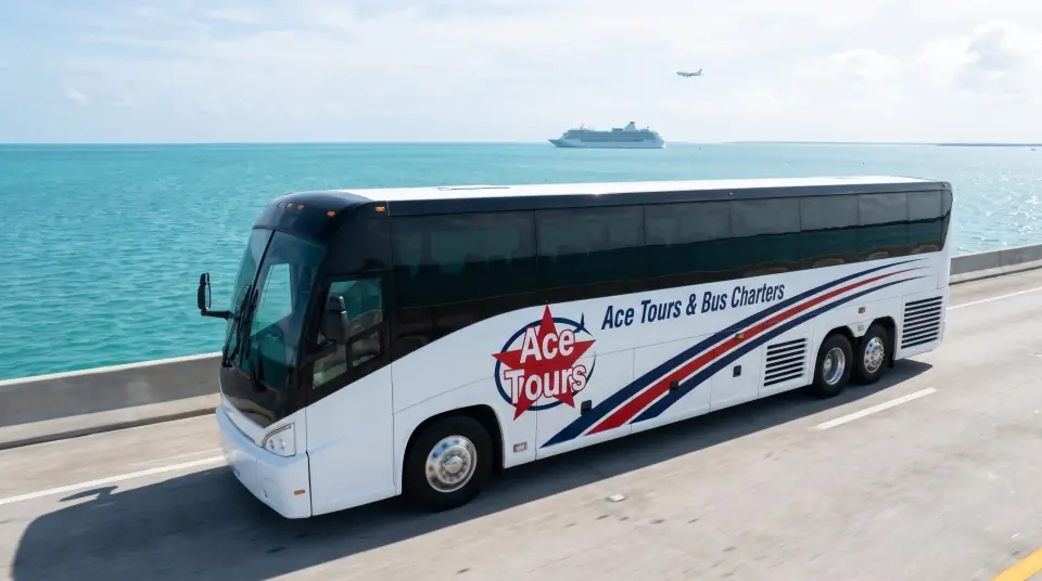 Illustration of a white Ace Tours & Bus Charters motorcoach on the Overseas Highway in the Florida Keys in late morning, turquoise water on both sides, seen from above
